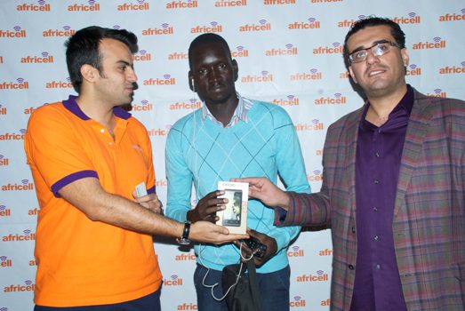 Milad (Left) and Jawad Qureshi (Right) handing over a brand new iDROID Simu to a lucky winner