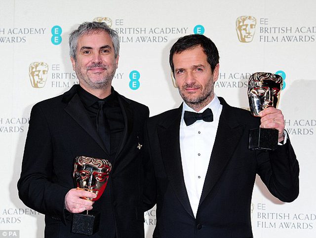 Winners; Alfonso Cuaron (left) and David Heyman hold the award for Best British Film Award for Gravity