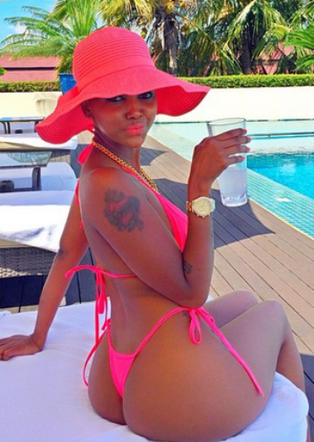 Huddah partying by the poolside