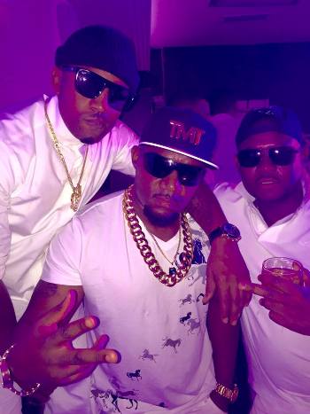 Cameroon Gitawo (C) with Meddie Ssentongo at the All White Party at Guvnor