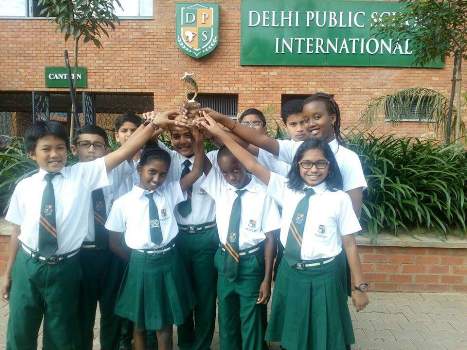 Students of Delhi Public School International pose with their award