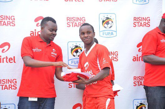 airtel-uganda-brand-and-assets-executive-musa-mayanja-awards-the-ars-2016-buganda-region-mvp-kafumbe-masood-with-a-brand-new-smartphone-and-an-airtel-tshirt