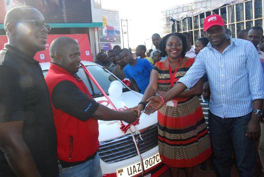 Airtel Uganda team led by Remmie Kisakye Head Brand and communications as they handed over the 6th recharge and mujje tulumbe 6th car to winner Muddu Jimmy