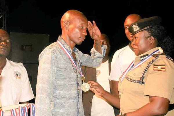 Uganda Police honors ‘Bryan White’, Urges youths to work hard