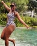 Nelly Kamwelu sizzles in new swimsuit poses