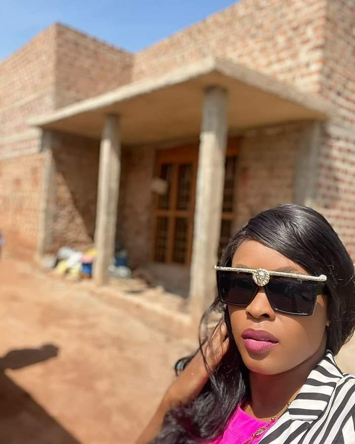 Grace Nakimera building a home for Feed The Streets Foundation